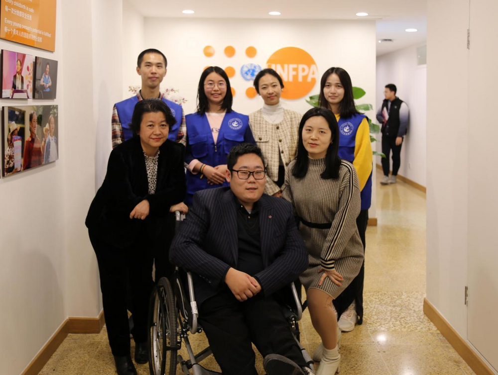 Group photo of volunteers with UNFPA China personnel.  ©UNFPA China/Chen Yihang