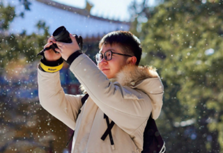 Photography is one hobby of He Yiqi. He likes to walk around and take pictures on his travels to record the beauty he sees.©UNFP
