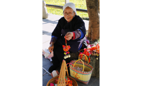 An older woman sells her handmade crafts in Guangxi province, China. Credit: UNFPA China/Liang Chuncai