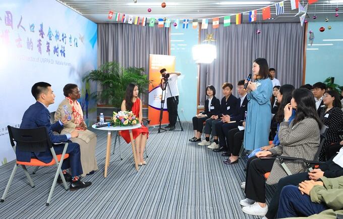 A youth representative sharing her story with Dr. Natalia Kanem on her participation in the UNFPA Leadership Project in Beijing on 25 April 2019. Photo credit: BIEG